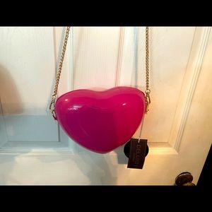 How cute is this pink heart mini bag it would be great for your daughters!!!
